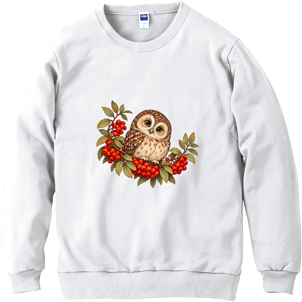 赤い実のリースと小さなフクロウ